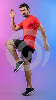 Full body length gaiety shot athletic sporty man with running posture