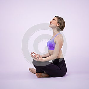 Full body length gaiety shot athletic and sporty woman doing yoga