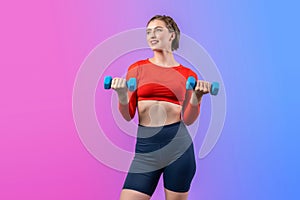 Full body length gaiety shot athletic and sporty woman with dumbbell