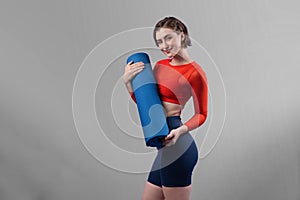 Full body length gaiety shot athletic sporty woman in fitness exercise posture