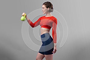 Full body length gaiety shot athletic and sporty woman with kettlebell