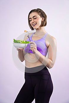 Full body length gaiety shot athletic and sporty young woman with healthy vegan