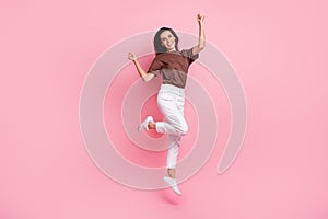 Full body length photo of young successful lady brunette hair business woman jumping celebration moment isolated on pink