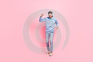 Full body length photo of youngster energetic funky guy listen his new headphones dancing love stereo music isolated on
