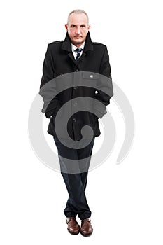 Full body of middle age business man posing wearing overcoat