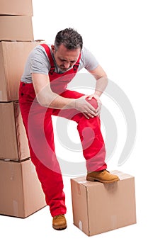 Full body of mover guy holding his knee like hurting