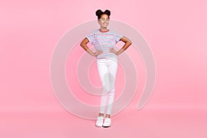 Full body photo of african american cheerful girl good mood hands waist smile isolated on pink color background