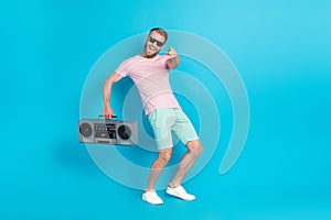 Full body photo of attractive young man point you energetic dancer dj tape recorder wear trendy pink look isolated on