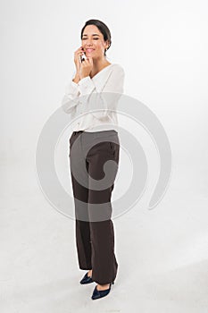 Full Body Photo of a Beautiful Brazilian Business Woman Talking on phone