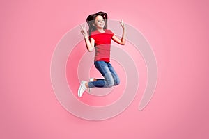 Full body photo of cheerful kid girl jump make v-sign wear red casual style outfit isolated over pastel color background