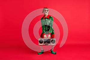 Full body photo of crazy elf hold boom box on x-mas christmas party wear costume isolated over bright color background
