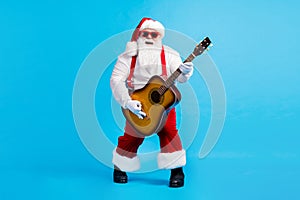Full body photo of fat funky santa claus with bif abdomen beard play guitar on x-mas christmas tradition party wear
