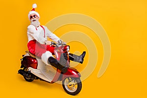 Full body photo of funny santa white hair grandpa rushing newyear party speed retro bike wear trendy sun specs red