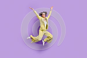 Full body photo of jumping energetic young girl bob hair raise hands up wear lime outfit flared clothes isolated on