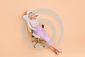Full body photo of nice retired female hands behind head sleep office armchair wear trendy formalwear isolated on beige