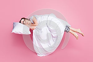 Full body photo of pretty lady saturday morning nap lying bed pillow hands under head covered blanket wear mask white t