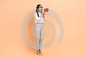 Full body photo of young business lady boss scream bullhorn announcement information empty space news isolated on beige