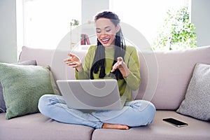 Full body photo of young happy woman sit sofa talk camera laptop inside house home indoors