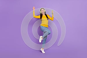 Full body photo of youth girl enjoy rhythm radio melody hold cellphone isolated over purple color background