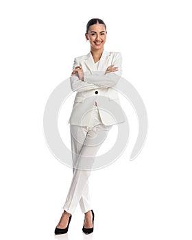 full body picture of elegant businesswoman folding arms and smiling