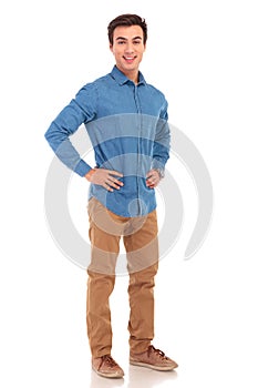 Full body picture of a man with hands on waist