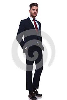 Full body picture of relaxed young businessman standing