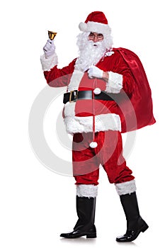 Full body picture of santa claus sounding his bell