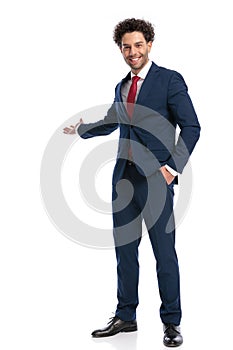 Full body picture of young turkish man welcoming and inviting