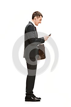 Full body portrait of businessman with briefcase on white