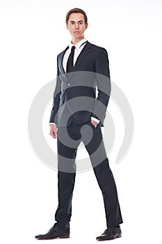 Full body portrait of a handsome young businessman in black suit