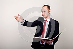 Full body portrait of happy smiling business man with red folder, isolated over white background