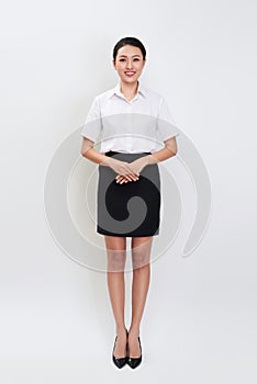 Full body portrait of happy smiling young beautiful business woman