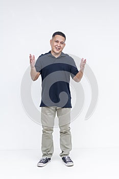 Full-body portrait of a middle-aged Asian man with open hand gestures, conceptually explaining something, isolated on white