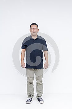 Full-body portrait of a middle-aged Asian man standing confidently on a clean white background, suitable for diverse visual needs