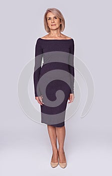 Full body portrait of middle aged woman