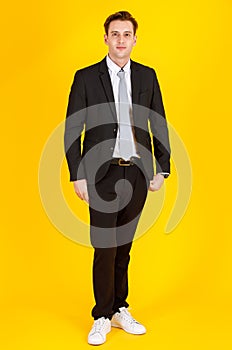 Full body portrait photo of handsome and executive look caucasian businessman in black suit pose in boss action and positive smile