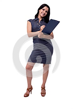 Full body portrait of smiling business woman in dress writes with clipboard and pen, isolated on white