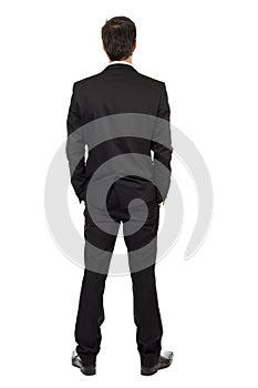 Full body portrait of young businessman, back view