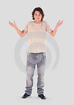 Full body portrait of young Man standing with grey background