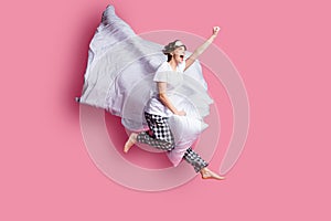 Full body profile photo of funny lady jump high pillow between legs blanket flight moving ahead wear sleep mask white t