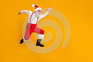 Full body profile side photo of crazy funky grey hair bearded grandfather hipster in red hat jump run enjoy x-mas time