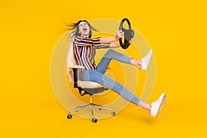 Full body profile side photo of young girl yell scared ride car steering-wheel fast speed isolated over yellow color