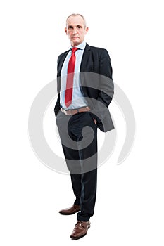 Full body senior business man posing with hands in pockets