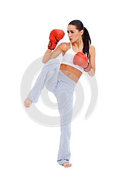 Full body shot of female kick boxer