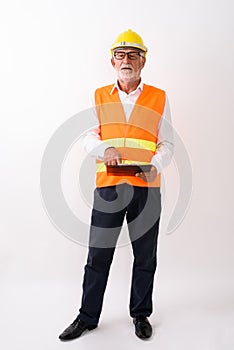 Full body shot of handsome senior bearded man construction worke