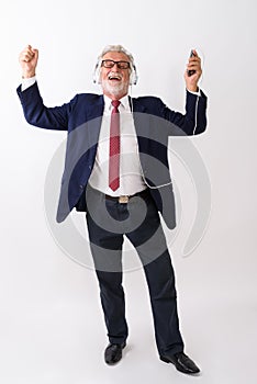 Full body shot of happy senior bearded businessman smiling while