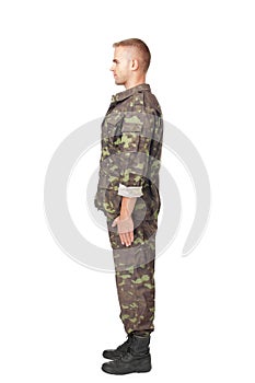 Full body side view of army soldier standing in attention