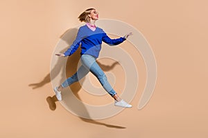 Full body size photo of graceful jumping running successful business lady in blue pullover and shirt isolated on beige