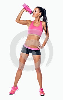 Full body studio portrait of a slim fitness female model dressed