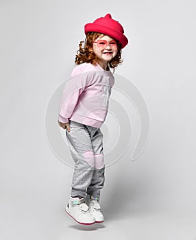 Cute little smiling giggling preschool toddler girl child studio shot